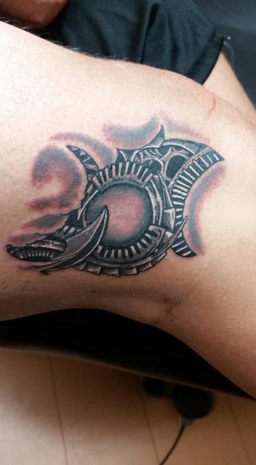 Biomechanical gear and blade knee tattoo