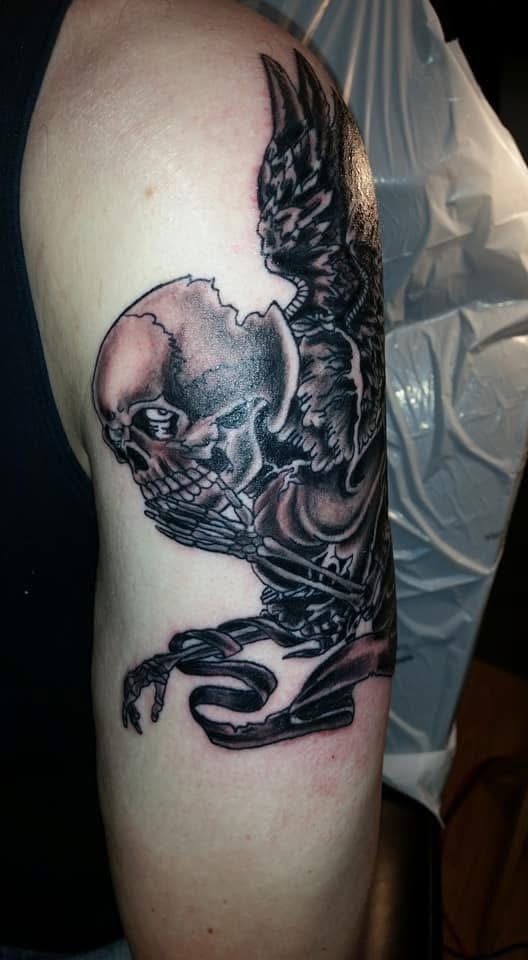 Winged skeleton warrior upper arm tattoo side view