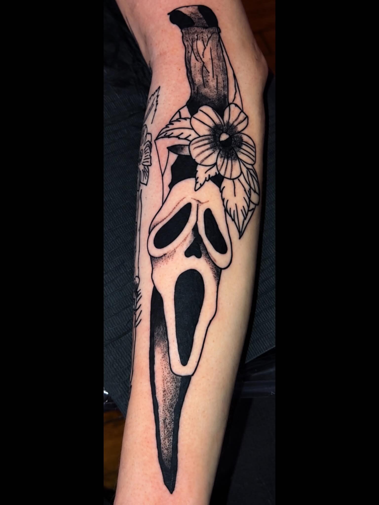 Illustrative blackwork tattoo