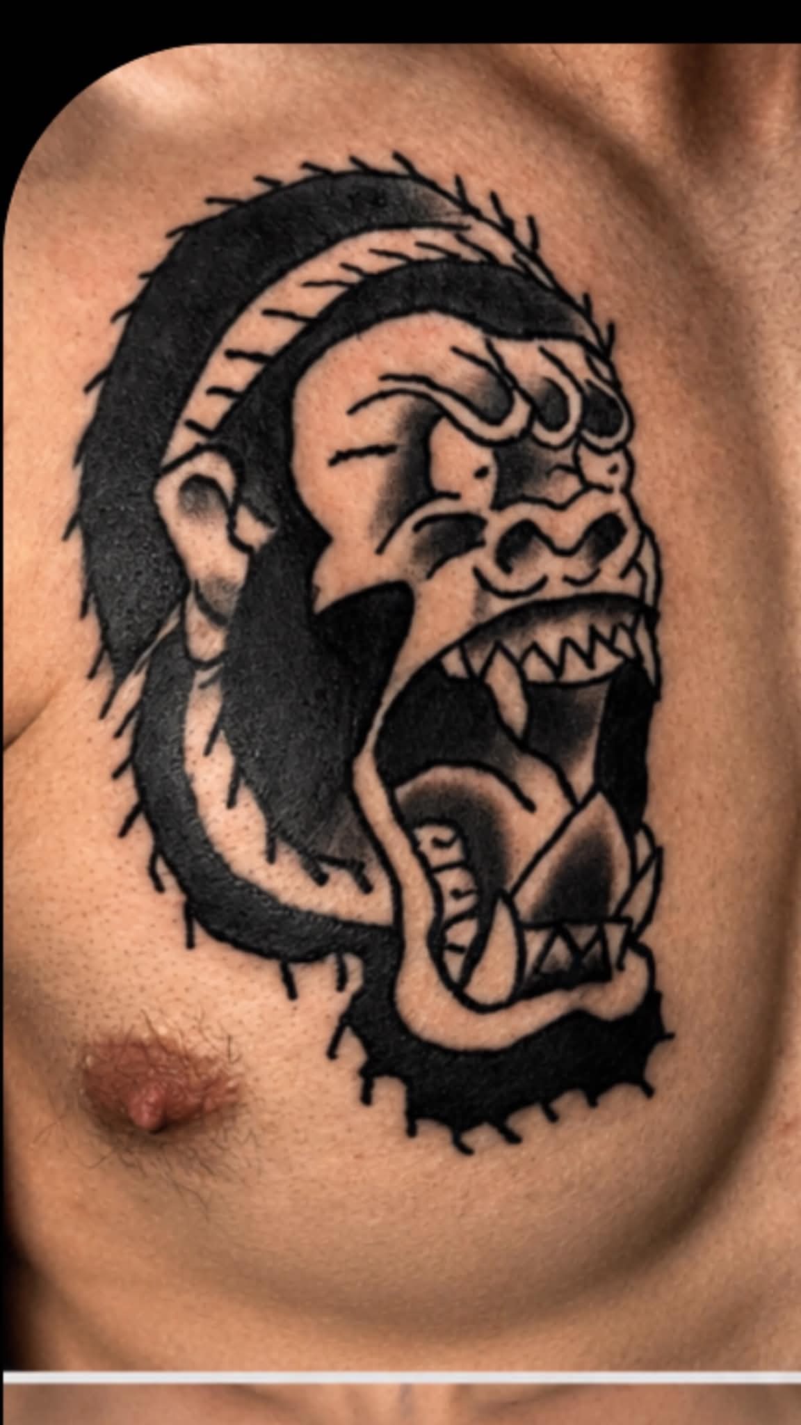 Traditional gorilla with open mouth chest tattoo