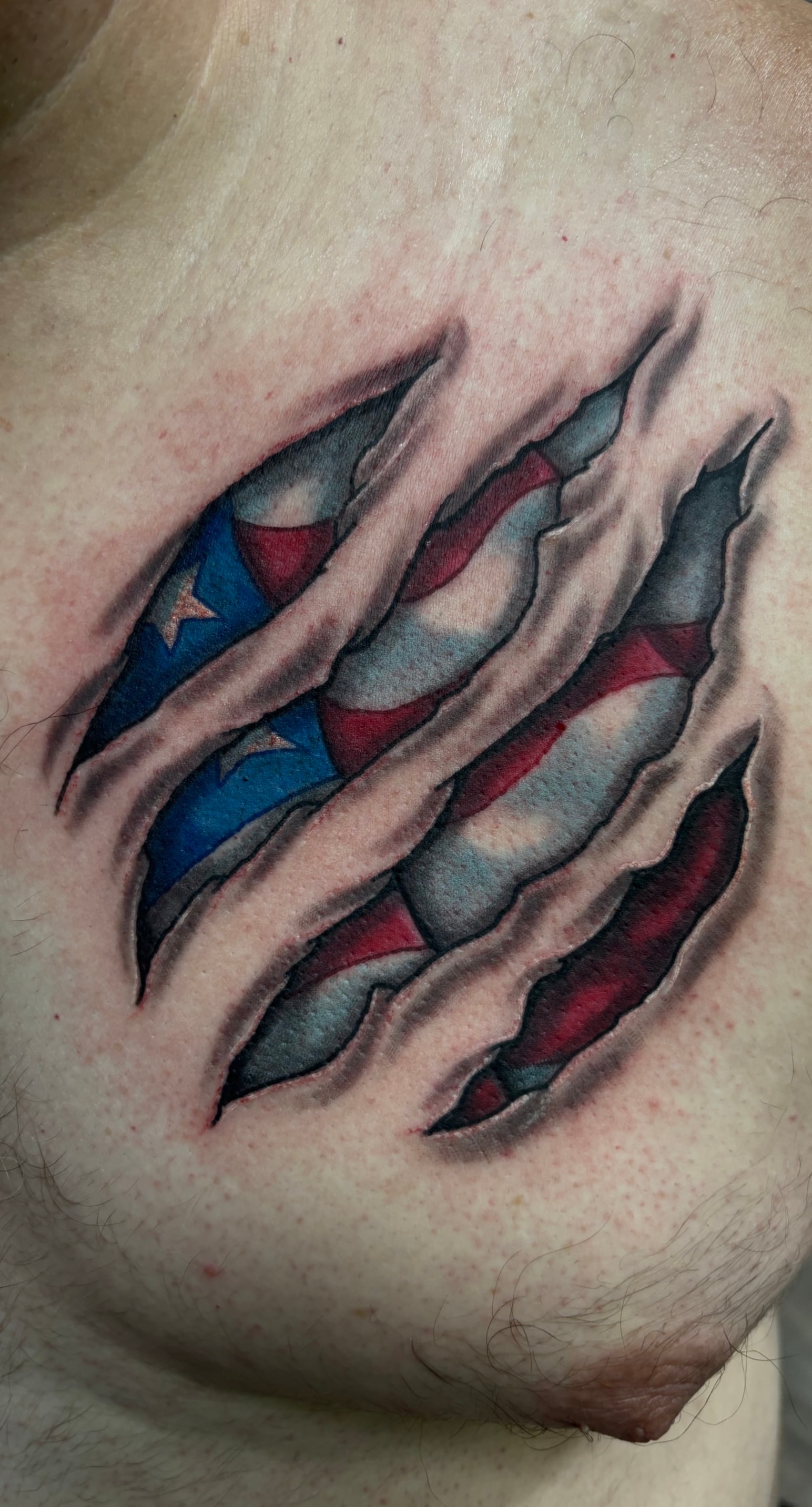 Randy DeShong American flag rip-skin tattoo